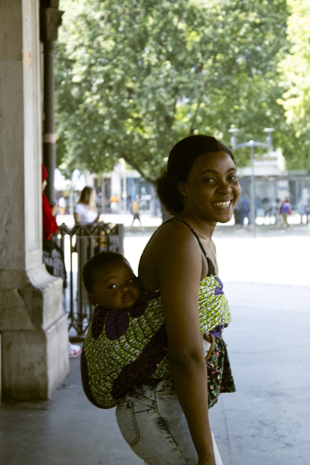 A child carried on a mother’s back